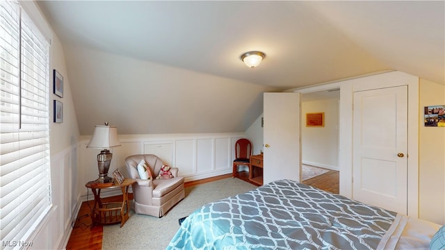 500 Elm St, Belpre, OH 45714 - bedroom with lofted ceiling and a wainscoted wall