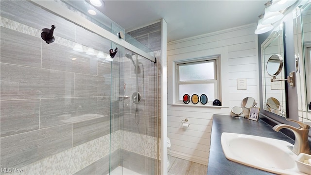 500 Elm St, Belpre, OH 45714 - full bathroom with vanity, a stall shower, ornamental molding, and wooden walls