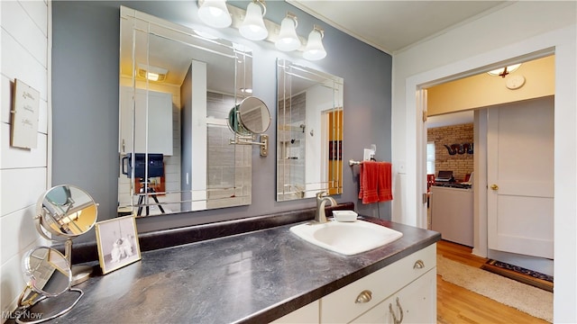500 Elm St, Belpre, OH 45714 - bathroom featuring vanity, wood finished floors, and crown molding