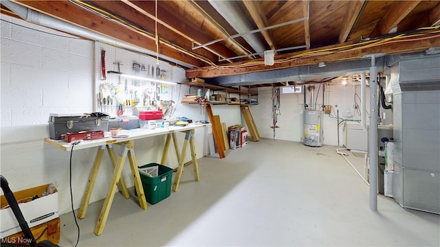 500 Elm St, Belpre, OH 45714 - unfinished below grade area featuring gas water heater, a workshop area, and heating unit