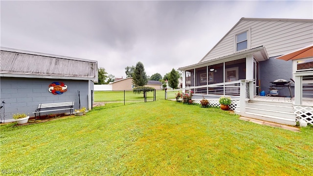 500 Elm St, Belpre, OH 45714 - view of yard featuring a sunroom and a wooden deck
