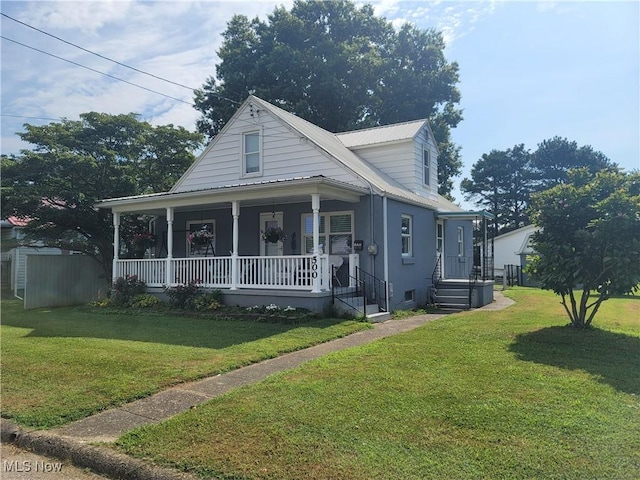 500 Elm St, Belpre, OH 45714 - view of front of home with a front yard, covered porch, and a metal roof