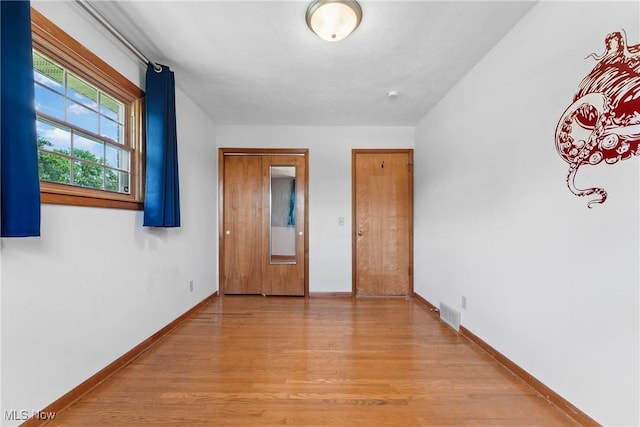 4130 Atwood Ave SE, Canton, OH 44707 - unfurnished bedroom with light wood-style flooring and baseboards