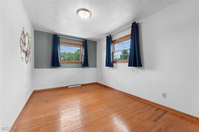 4130 Atwood Ave SE, Canton, OH 44707 - unfurnished room featuring wood finished floors and wainscoting