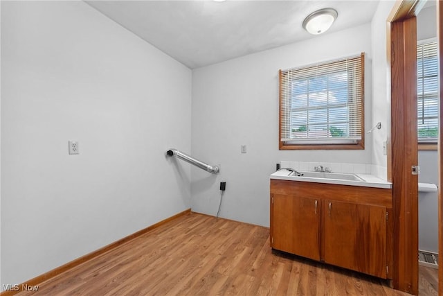4130 Atwood Ave SE, Canton, OH 44707 - bathroom featuring wood finished floors and vanity
