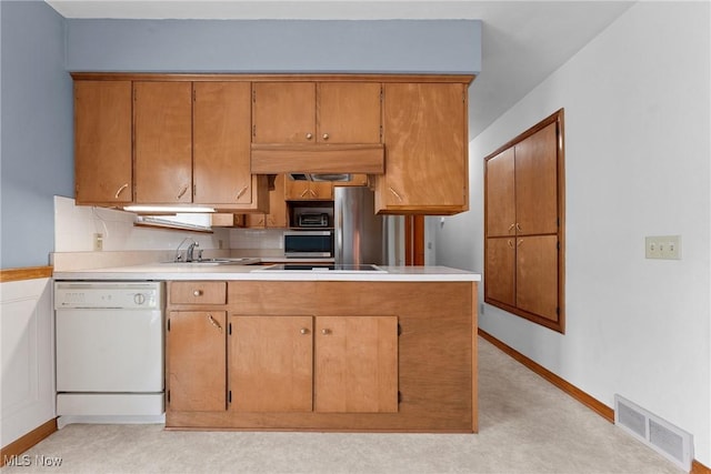 4130 Atwood Ave SE, Canton, OH 44707 - kitchen featuring dishwasher, light countertops, cooktop, backsplash, and brown cabinets