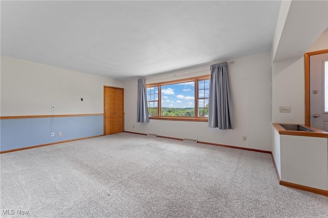 4130 Atwood Ave SE, Canton, OH 44707 - carpeted spare room featuring baseboards