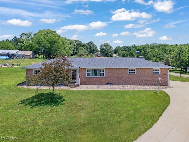 4130 Atwood Ave SE, Canton, OH 44707 - view of front of home with brick siding, a front yard, and concrete driveway