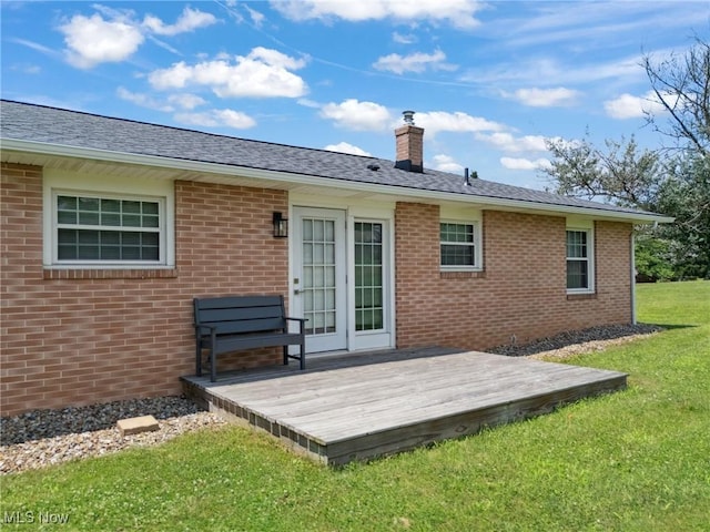 4130 Atwood Ave SE, Canton, OH 44707 - rear view of property with a chimney, a wooden deck, brick siding, and a lawn