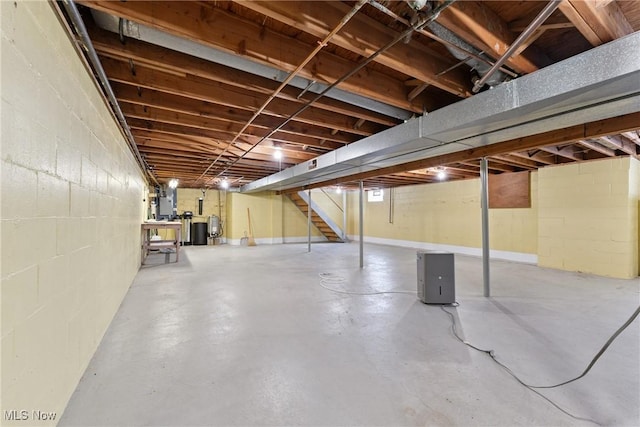 4130 Atwood Ave SE, Canton, OH 44707 - unfinished below grade area with stairway, concrete block wall, and a water softener