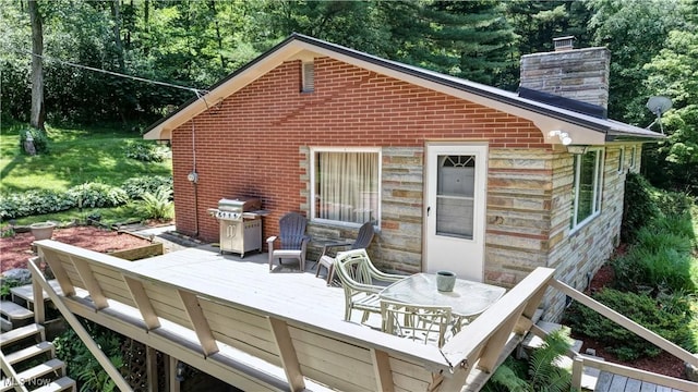 5882 Crooked Run Rd SW, New Philadelphia, OH 44663 - wooden deck with a grill and outdoor dining space