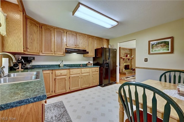 5882 Crooked Run Rd SW, New Philadelphia, OH 44663 - kitchen featuring black appliances, under cabinet range hood, dark countertops, and light flooring