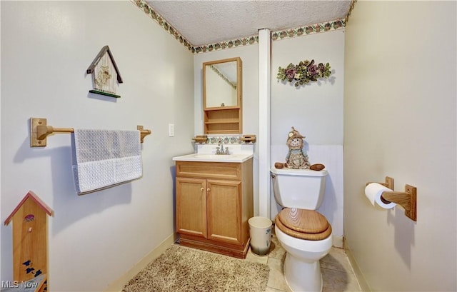 5882 Crooked Run Rd SW, New Philadelphia, OH 44663 - bathroom featuring vanity, a textured ceiling, and tile patterned floors