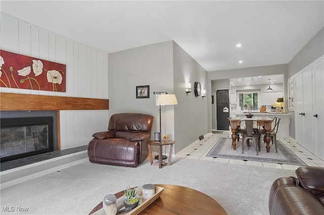 889 Eaton Ave, Akron, OH 44303 - living area with tile patterned floors, a large fireplace, and recessed lighting