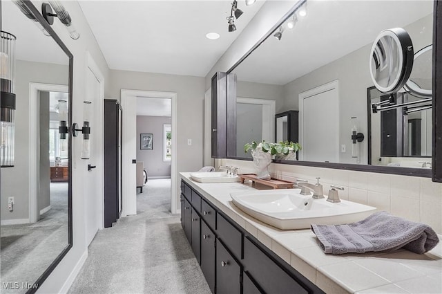889 Eaton Ave, Akron, OH 44303 - full bath featuring double vanity and baseboards