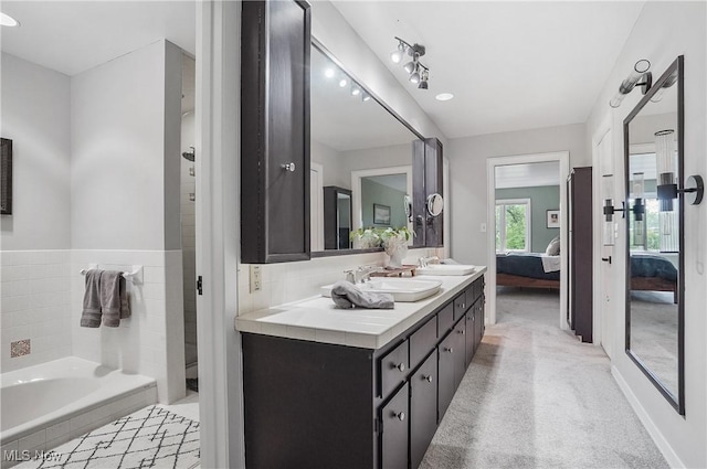 889 Eaton Ave, Akron, OH 44303 - bathroom featuring ensuite bath, double vanity, and a garden tub