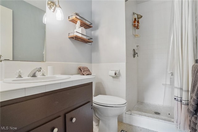 889 Eaton Ave, Akron, OH 44303 - full bath with vanity, tiled shower, and tile walls