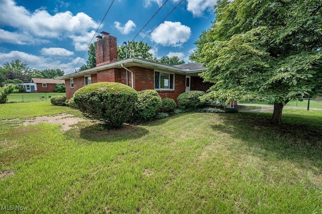 3800 7th Ave, Vienna, WV 26105 - view of side of property with a chimney and brick siding
