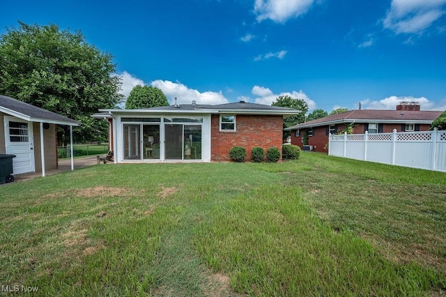 3800 7th Ave, Vienna, WV 26105 - rear view of house featuring a sunroom and brick siding
