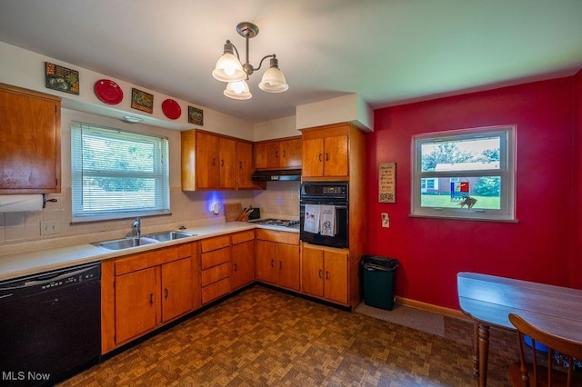 3800 7th Ave, Vienna, WV 26105 - kitchen with black appliances, light countertops, a chandelier, brown cabinets, and decorative backsplash