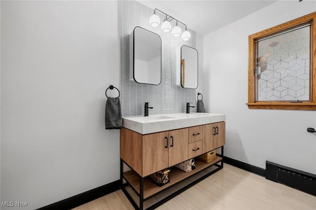 903 Robinson Ave, Barberton, OH 44203 - full bathroom featuring double vanity and backsplash