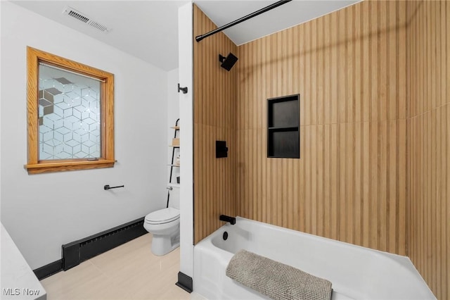 903 Robinson Ave, Barberton, OH 44203 - full bathroom featuring a baseboard radiator and tub / shower combination
