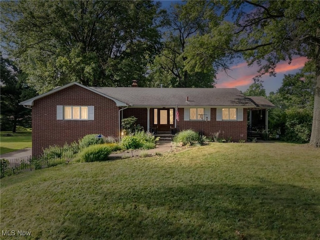 903 Robinson Ave, Barberton, OH 44203 - single story home with brick siding, a front lawn, and a chimney
