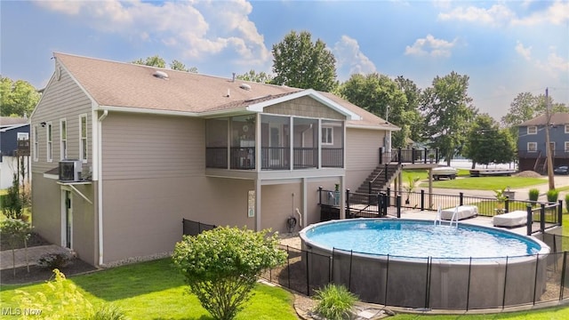 31 Anns Dr, Vienna, WV 26105 - back of property featuring stairs, a wooden deck, and a sunroom