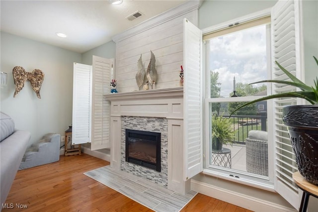 31 Anns Dr, Vienna, WV 26105 - living room with wood finished floors, healthy amount of natural light, a fireplace, and recessed lighting