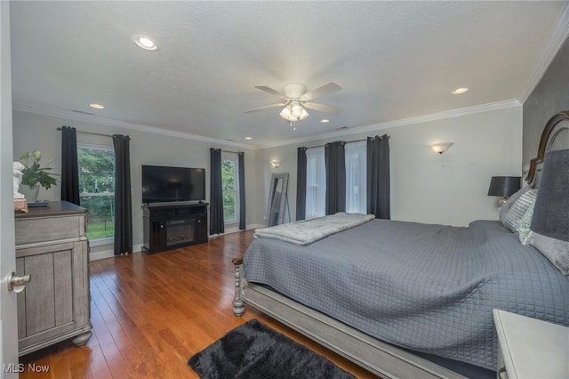 31 Anns Dr, Vienna, WV 26105 - bedroom featuring wood finished floors, a ceiling fan, crown molding, a fireplace, and recessed lighting