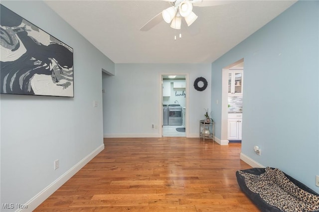 31 Anns Dr, Vienna, WV 26105 - unfurnished living room featuring ceiling fan and light wood-style floors