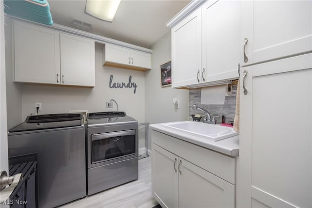 31 Anns Dr, Vienna, WV 26105 - laundry room with washer and dryer and cabinet space