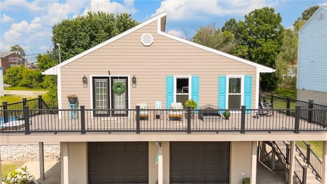 31 Anns Dr, Vienna, WV 26105 - back of house with an attached garage and a deck