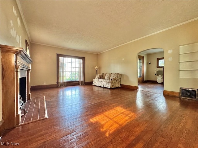 825 Summit St, Salem, OH 44460 - living room with arched walkways, plenty of natural light, a textured ceiling, wood-type flooring, and a fireplace with flush hearth