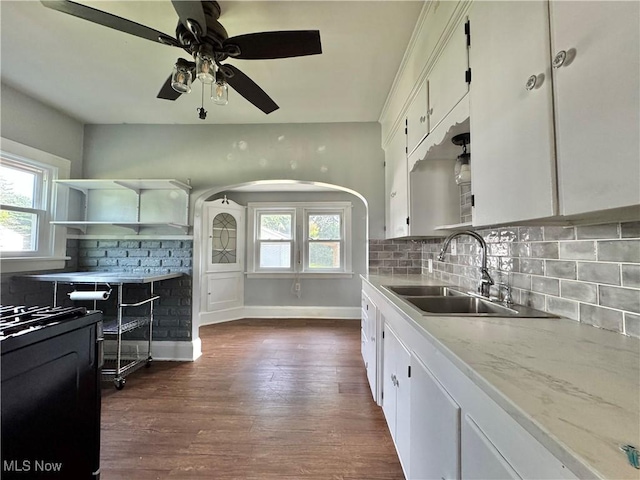 825 Summit St, Salem, OH 44460 - kitchen featuring white cabinets, decorative backsplash, dark wood-type flooring, and a ceiling fan