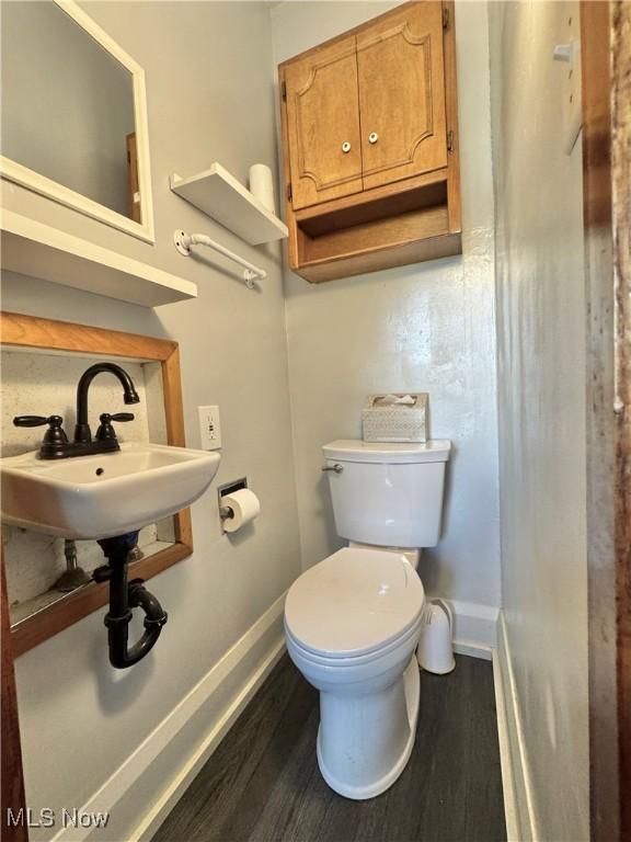 825 Summit St, Salem, OH 44460 - half bathroom with wood finished floors and toilet