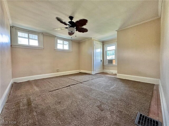 825 Summit St, Salem, OH 44460 - carpeted spare room featuring ornamental molding, healthy amount of natural light, ceiling fan, and cooling unit