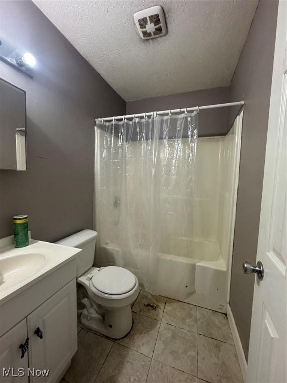 67 Neil Ann Dr, Parkersburg, WV 26101 - full bathroom with a textured ceiling, vanity, shower / bath combo, and tile patterned flooring