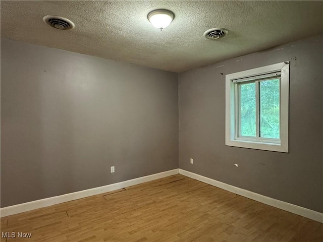 67 Neil Ann Dr, Parkersburg, WV 26101 - empty room featuring light wood-style floors and a textured ceiling