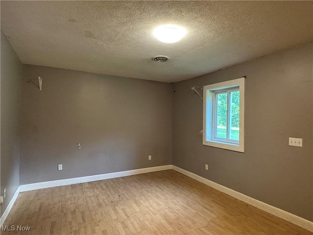 67 Neil Ann Dr, Parkersburg, WV 26101 - unfurnished room featuring wood finished floors and a textured ceiling