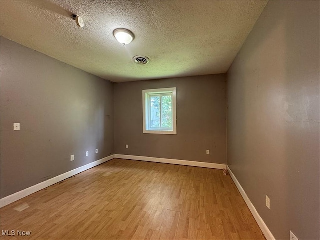 67 Neil Ann Dr, Parkersburg, WV 26101 - spare room featuring wood finished floors and a textured ceiling