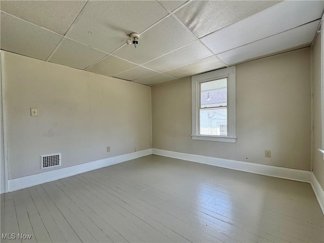 329 E Broad St, Newton Falls, OH 44444 - empty room featuring a drop ceiling and wood finished floors