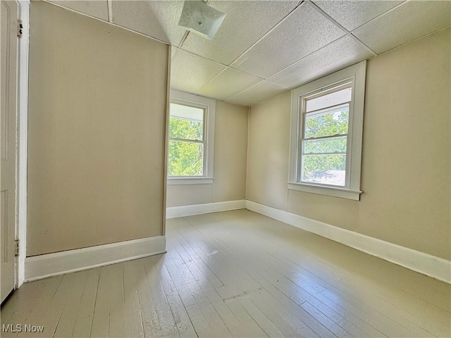 329 E Broad St, Newton Falls, OH 44444 - spare room with healthy amount of natural light, hardwood / wood-style flooring, and a paneled ceiling