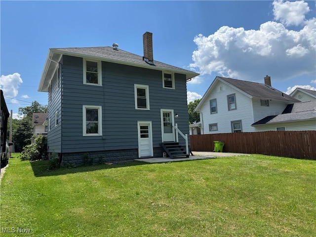329 E Broad St, Newton Falls, OH 44444 - back of house with entry steps and a chimney