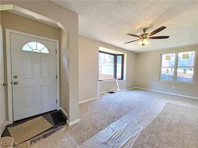 1006 Jackson Ave, Parkersburg, WV 26101 - carpeted foyer entrance with a ceiling fan and a textured ceiling