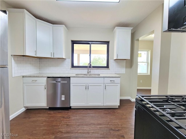 1006 Jackson Ave, Parkersburg, WV 26101 - kitchen featuring stainless steel dishwasher, white cabinets, and plenty of natural light