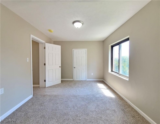 1006 Jackson Ave, Parkersburg, WV 26101 - unfurnished bedroom with light carpet and baseboards