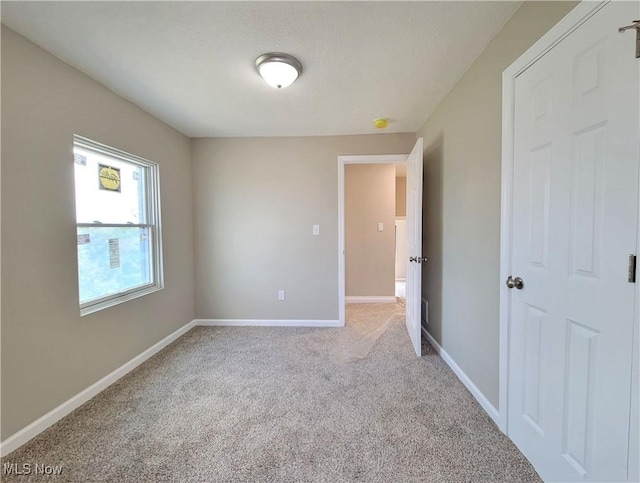 1006 Jackson Ave, Parkersburg, WV 26101 - spare room featuring light carpet and a smoke detector