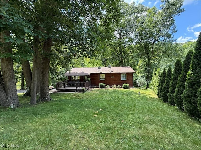 415 Middle Run Rd, Chester, WV 26034 - view of green lawn with a wooden deck and a forest view