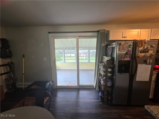 221 S Elm St, Jefferson, OH 44047 - kitchen featuring stainless steel fridge with ice dispenser, dark wood-type flooring, white cabinetry, and a baseboard heating unit